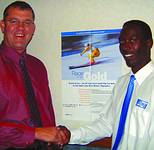 Pieter du Toit (MD ADT Security Guarding) congratulates Gilbert Mthembu